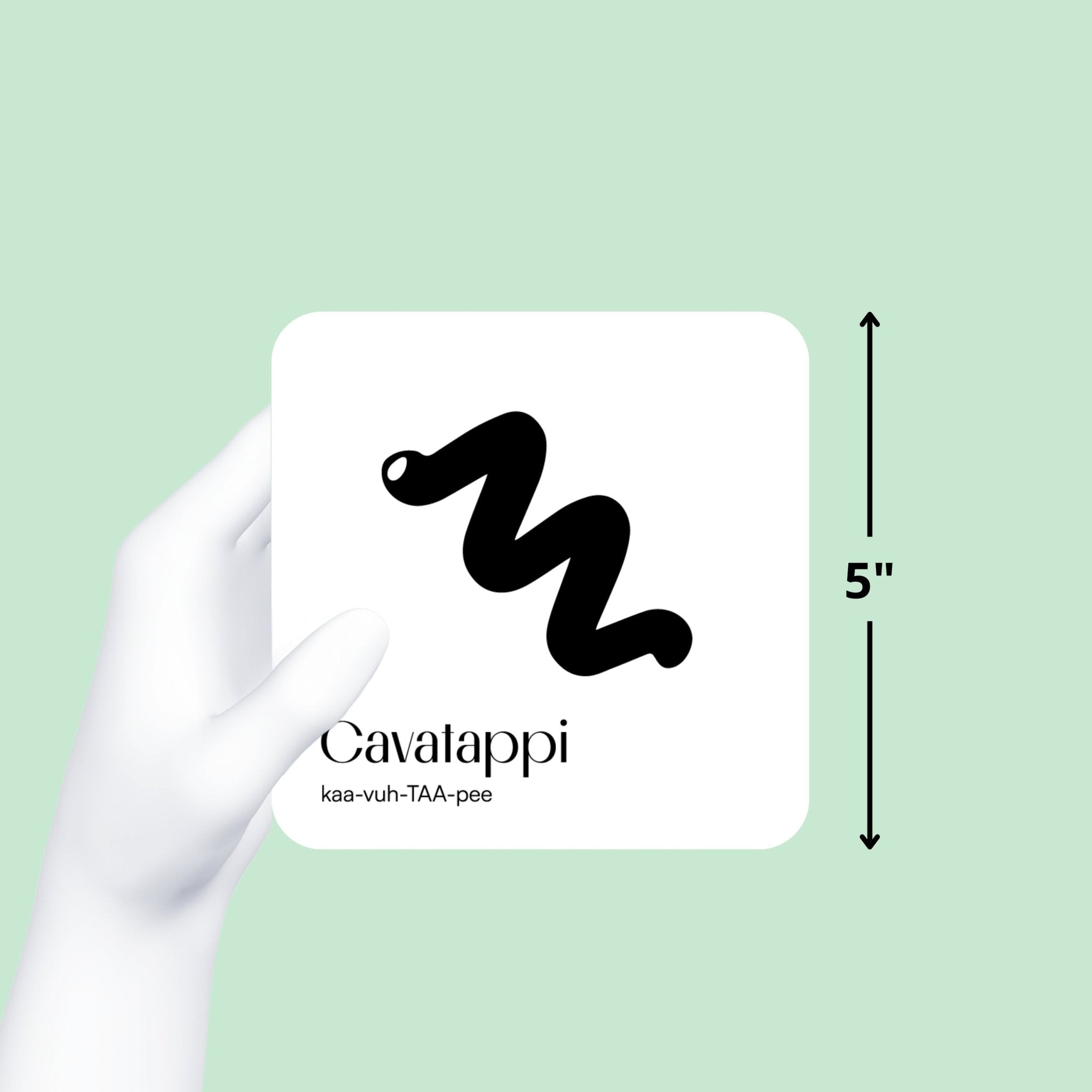 Gloved hand holds a black and white "Cavalappi" art card, showing its 5-inch size on a mint green background.