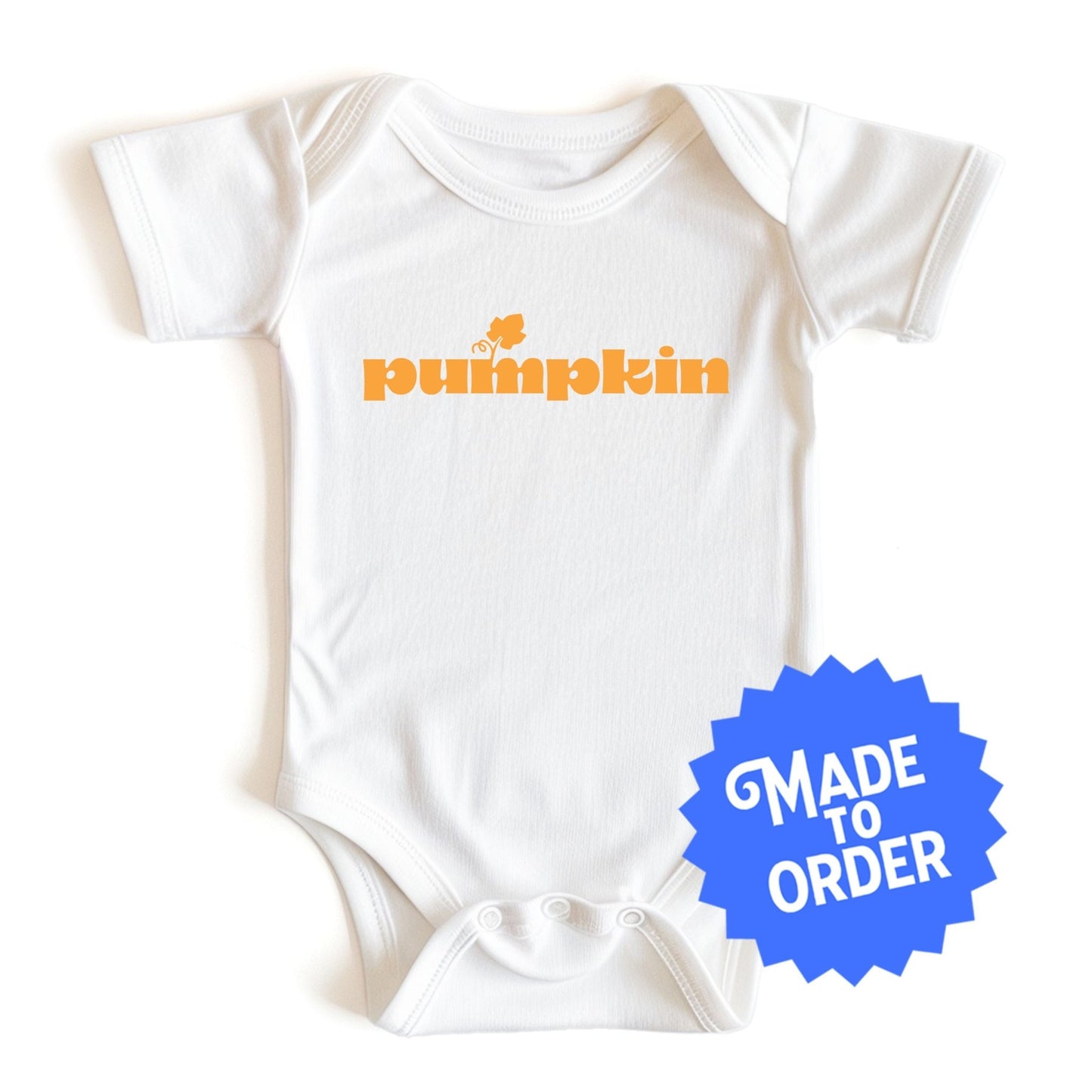 Chunky Deli product image: "Pumpkin" onesie (100% cotton, natural color) laid flat on a white background, showcasing the envelope shoulders, short sleeves, three-snap closure, and the text "Pumpkin" printed in orange across the chest.