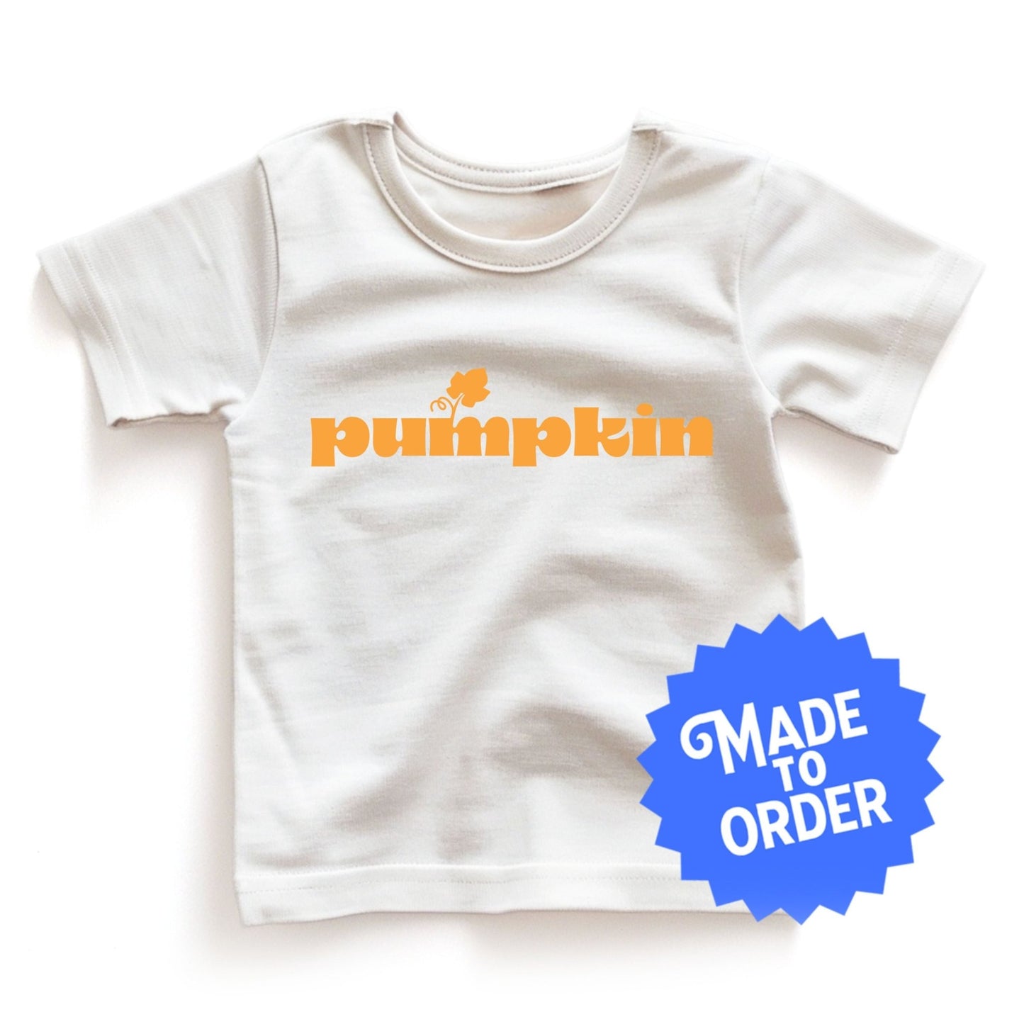 Chunky Deli product image: White "Pumpkin" toddler t-shirt with short sleeves. The text "Pumpkin" is printed in orange across the front.