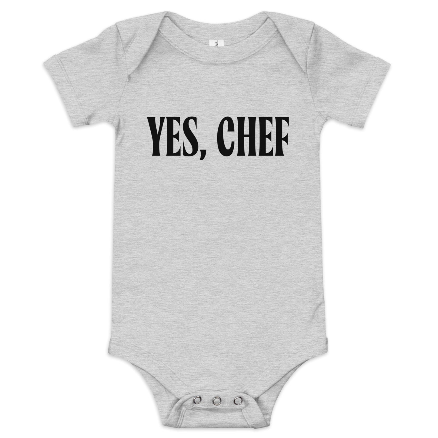 Chunky Deli product image: "Yes, Chef" onesie (100% cotton, grey color) laid flat on a white background, showcasing the envelope shoulders, short sleeves, three-snap closure, and the text "Yes, Chef" printed in black across the chest.