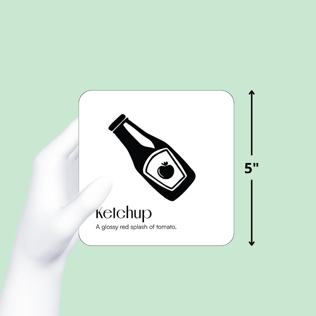 Hand holding a Chunky Deli black and white ketchup baby art card with a graphic showing the card is 5 inches tall.