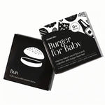 Chunky Deli product image: Open box of "Burger for Baby" high-contrast black and white art cards for babies' visual stimulation and sensory play, showcasing a card with a high-contrast image of a bun. All laid flat on a white background.