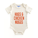 Chunky Deli product image: Natural-colored "Hugs & Chicken Nuggs" bodysuit (100% cotton) laid flat on a white background, showcasing the envelope shoulders and three-snap closure.