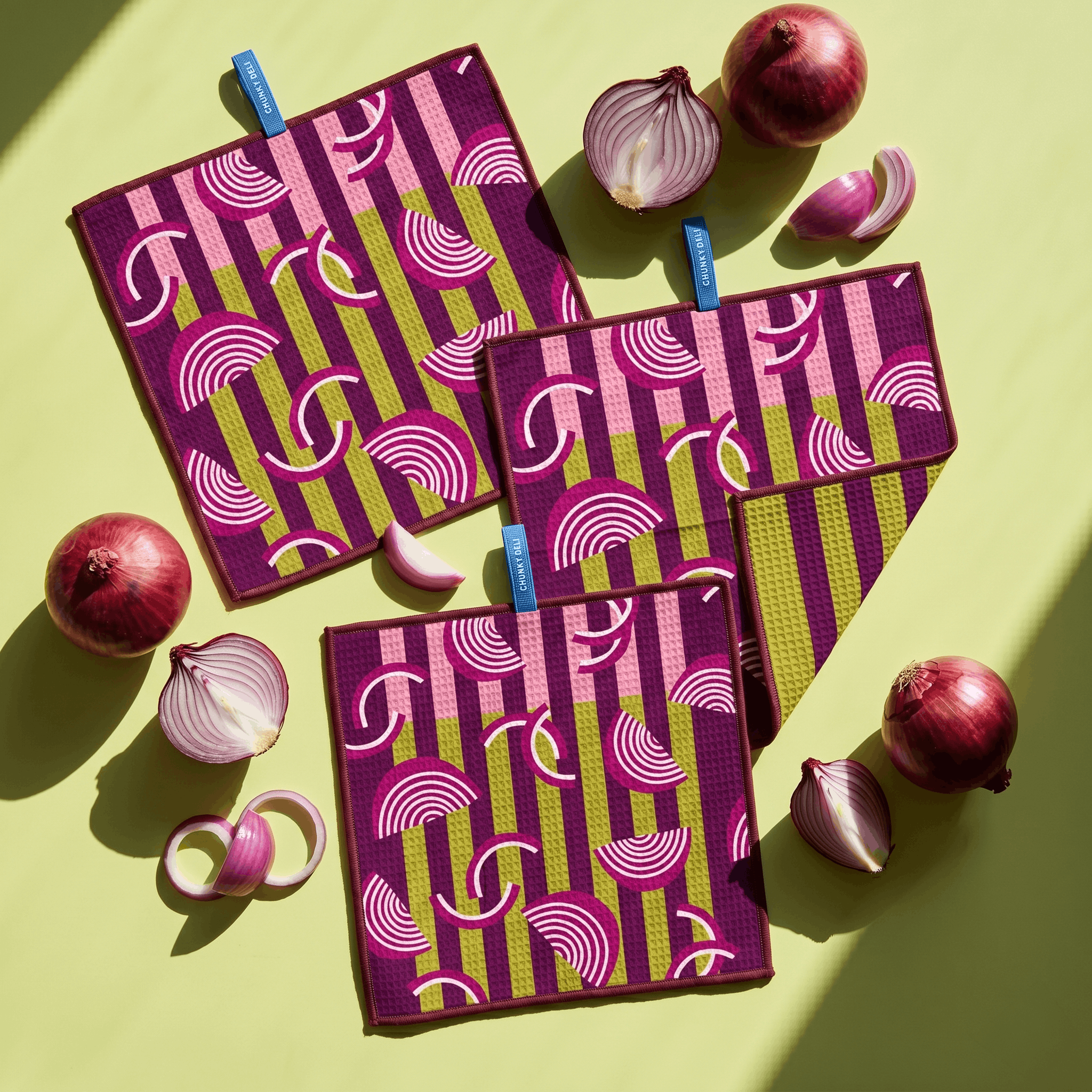 Chunky Deli product image of a three purple cloths with onions on a yellow background