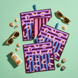 Chunky Deli product image of a set of three purple and pink patterned cleanup cloths featuring shrimp with sunglasses and a bottle on a green background