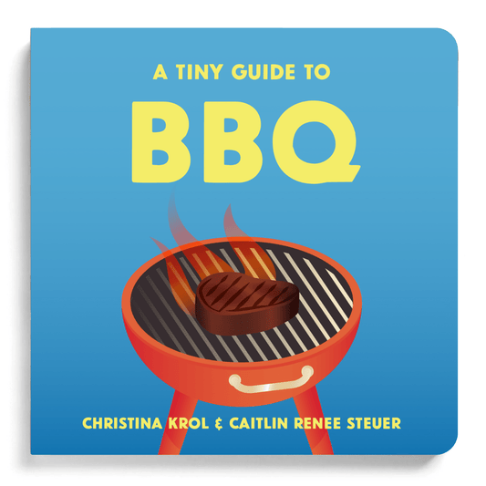 Chunky Deli product Image. The bright blue cover of the board book 'A Tiny Guide to BBQ' showcases a bold yellow title above a classic red grill with cartoon flames and a steak. Authors Caitlin Renee Steuer and Christina Krol.