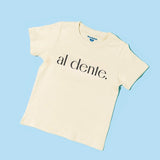Chunky Deli product image: Toddler tee in 100% cotton, short sleeve, beige/natural color. Features printed text reading "al dente" in black lettering on the chest on a light blue background.