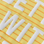 Close-up of the Better with Butter Kids Crewneck Sweater showing bright yellow fabric with white text.