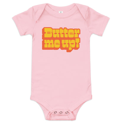 Chunky Deli product image: "Butter Me Up" onesie (100% cotton, pink color) laid flat on a white background, showcasing the envelope shoulders, short sleeves, three-snap closure, and the text "Butter Me Up" printed in orange and red across the chest.