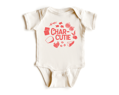 Chunky Deli product image: Natural-colored "Charcutie" bodysuit, 100% cotton with envelope shoulders and three-snap closure, laid flat on a white background.