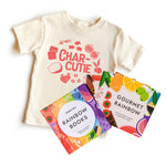 Chunky Deli "Fancy Flavors Collection" featuring a nude, 100% cotton, short sleeve toddler tee with a "CHAR-CUTIE" graphic in red, accompanied by the "Rainbow Books Fancy Flavors Collection" slipcase and individual books: "Gourmet Rainbow" by Caitlin Rene