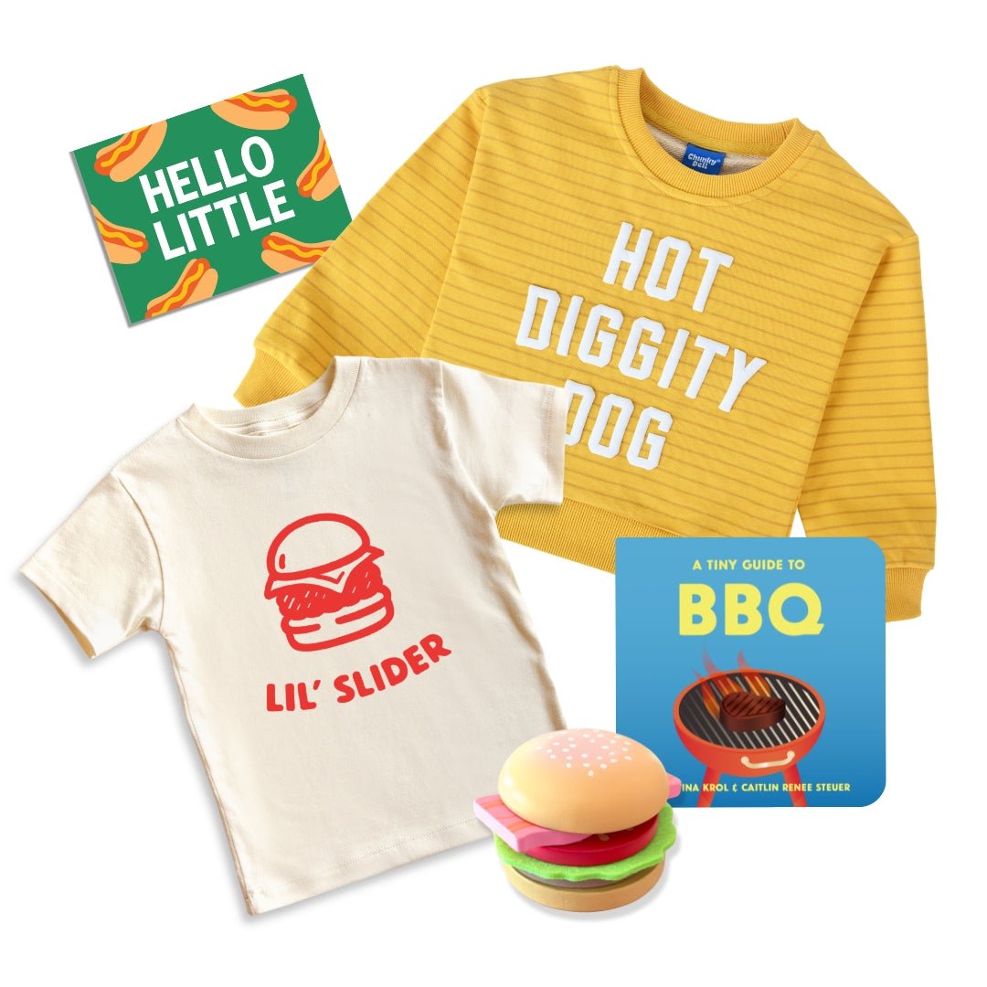 Grill master Toddler Gift bundle | Chunky deli product image containing "Lil' Slider" Kids Tee, Hot Diggity Dog Sweater, A tiny Guide to BBQ, A Toy burger and a hello little gift note with a hot dog theme.
