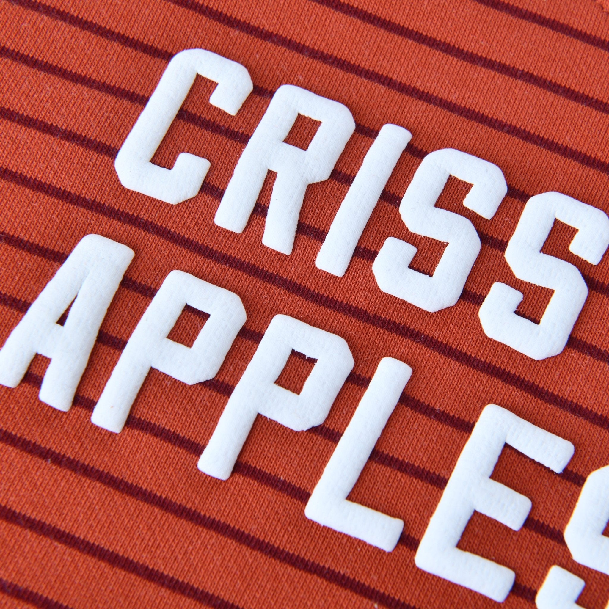 Criss Cross Applesauce Kids Crewneck Sweater featuring soft, red stripes and bold white lettering from Chunky Deli.