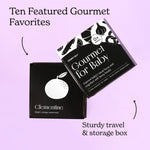 Black and white Gourmet for Baby art card set on a light purple background with two arrows pointing to the cards and box.