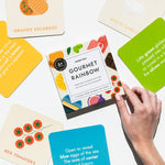  Chunky Deli product image: "Gourmet for Rainbow" art cards box held in place by a model's hand, surrounded by cards from the set, some showing sight word poems and rhymes, others displaying illustrations and titles.