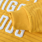 Close-up of Hot Diggity Dog Kids Crewneck Sweater highlighting soft fabric and ribbed cuff in bright orange stripes.