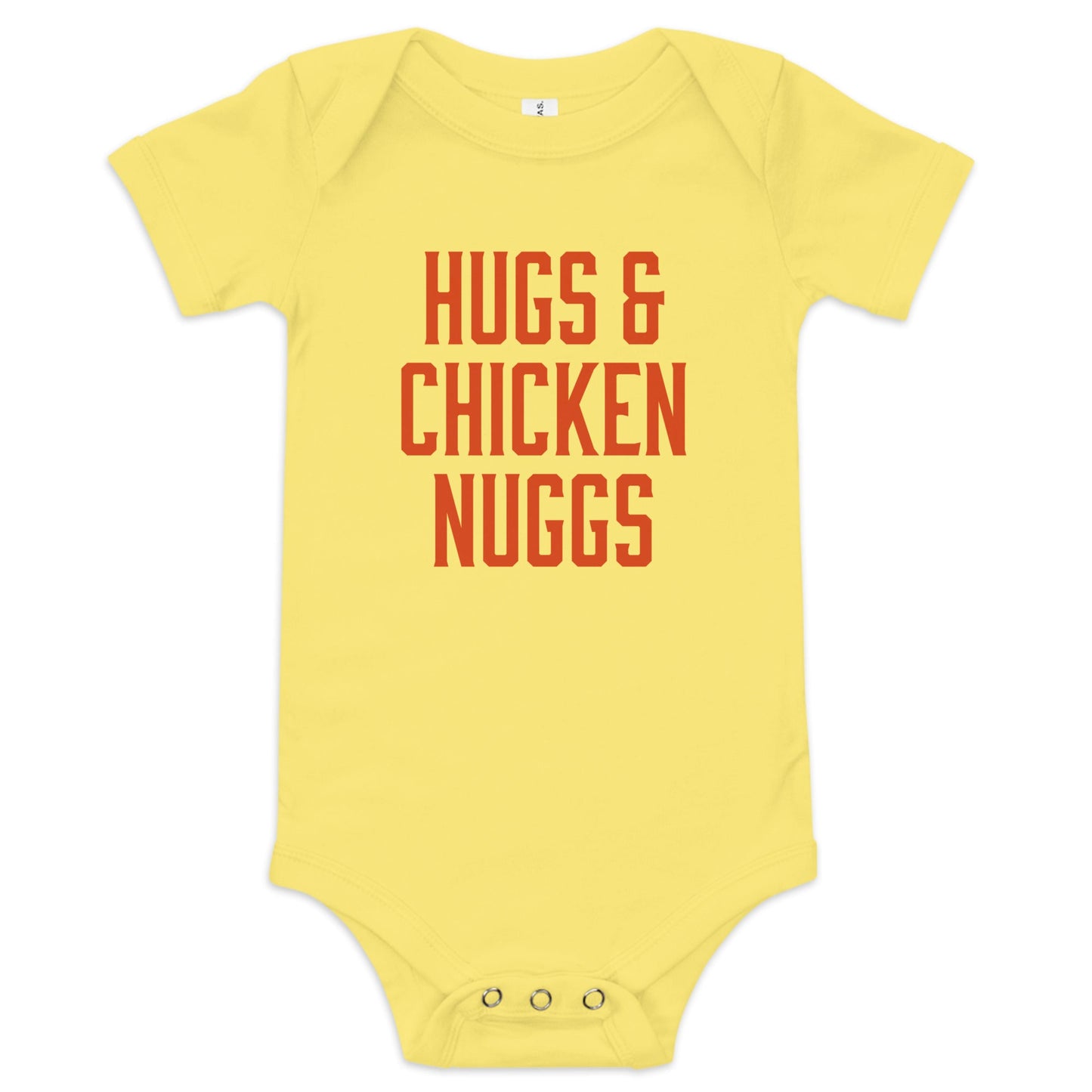 Chunky Deli product image: "Hugs and Chicken Nugs" bodysuit (100% cotton, yellow color) laid flat on a white background, showcasing the envelope shoulders, short sleeves, three-snap closure, and the text "Hugs and Chicken Nugs" in orange font on the chest