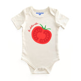 White baby onesie with red tomato graphic and text on a white background