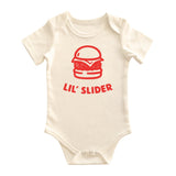Chunky Deli baby bodysuit made from 100% cotton, short sleeve, beige/natural color featuring a red burger outline graphic with the words 'Lil’ Slider' printed underneath. Includes envelope neckline and snap closure.