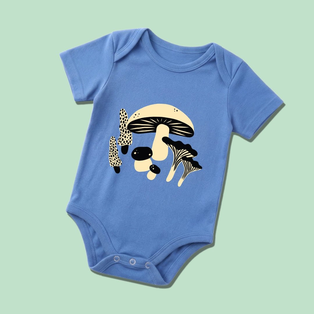 Chunky Deli product image: Baby Bodysuit in 100% cotton, short sleeve, blue color. Features a graphic illustration of mushrooms in 2 colors, black and beige, centered on the chest on a pastel green background.