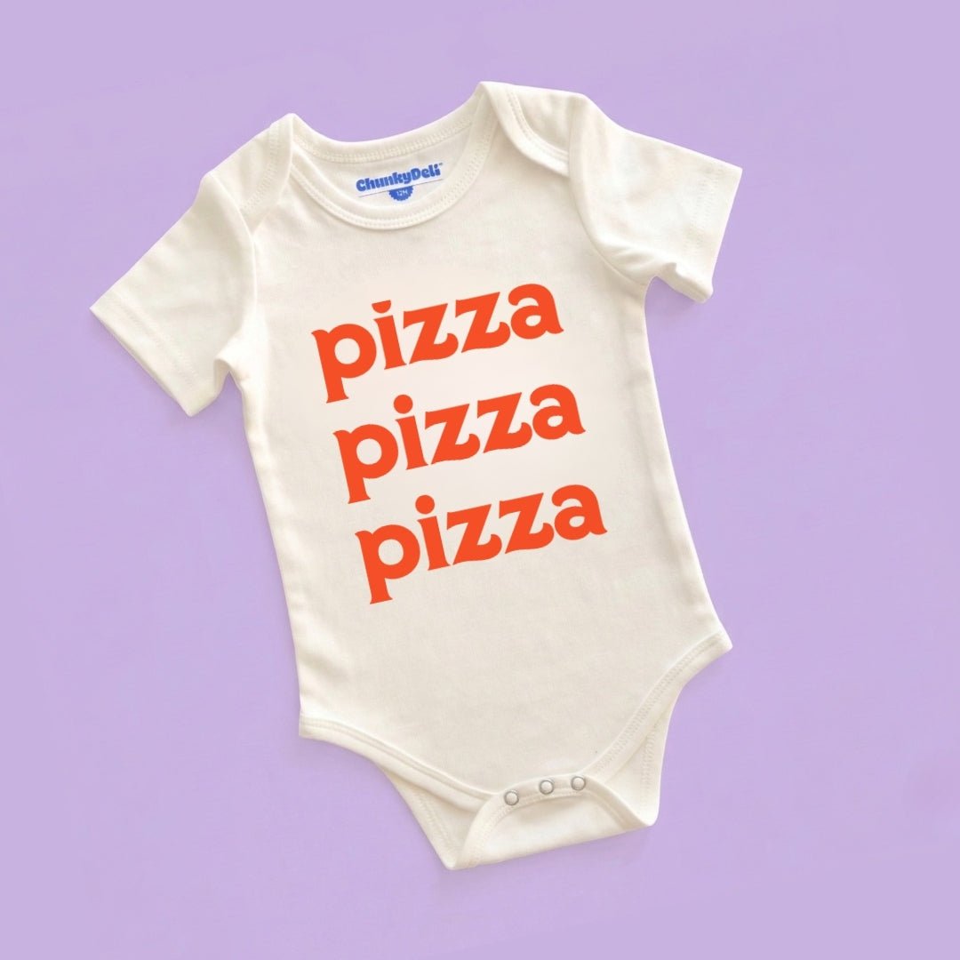 Chunky Deli product image: Natural-colored "Pizza Pizza Pizza" bodysuit (100% cotton) laid flat on a pastel purple background, showcasing the envelope shoulders and three-snap closure.