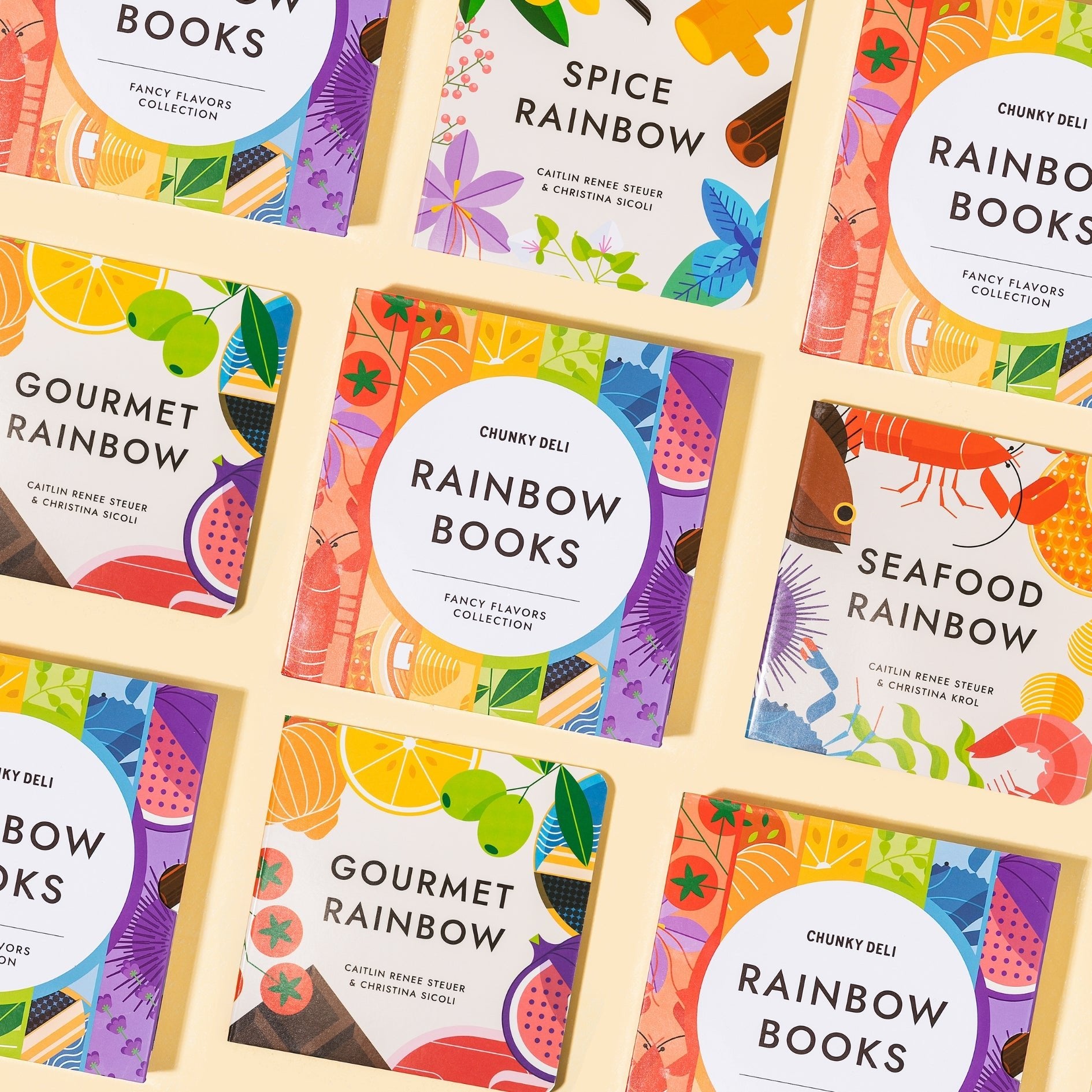 Square books from the Chunky Deli collection are arranged in a grid on a white surface. The books are "Rainbow Books," "Spice Rainbow," "Gourmet Rainbow," and "Seafood Rainbow."