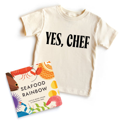 Chunky Deli bundle: 'Yes, Chef' toddler tee, 100% cotton, nude, short sleeve with bold black text. Includes 'Seafood Rainbow' by Christina Sicoli and Caitlin Renee Steuer, 6x6 board book, 20 pages, colorful sea creatures and poems.