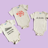 Chunky Deli product image: Three natural-colored bodysuits fanned out on a purple background, each displaying a different graphic design: "Petite Frite," "Charcutie," and "Al Dente."