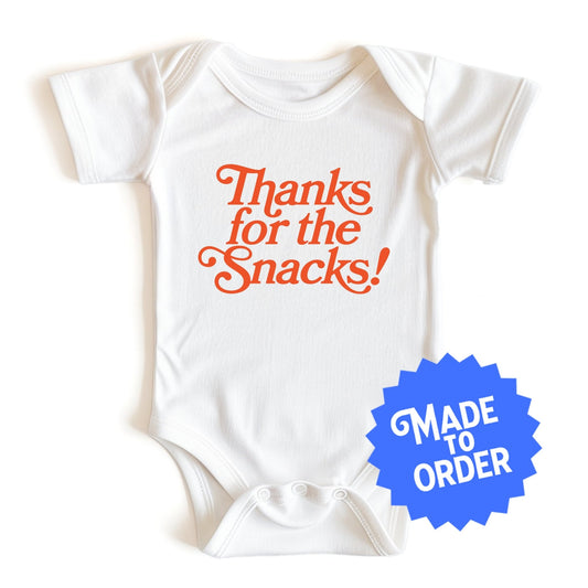 Chunky Deli product image: Natural-colored "Thanks for the Snacks!" onesie, 100% cotton with envelope shoulders and three-snap closure, laid flat on a white background.