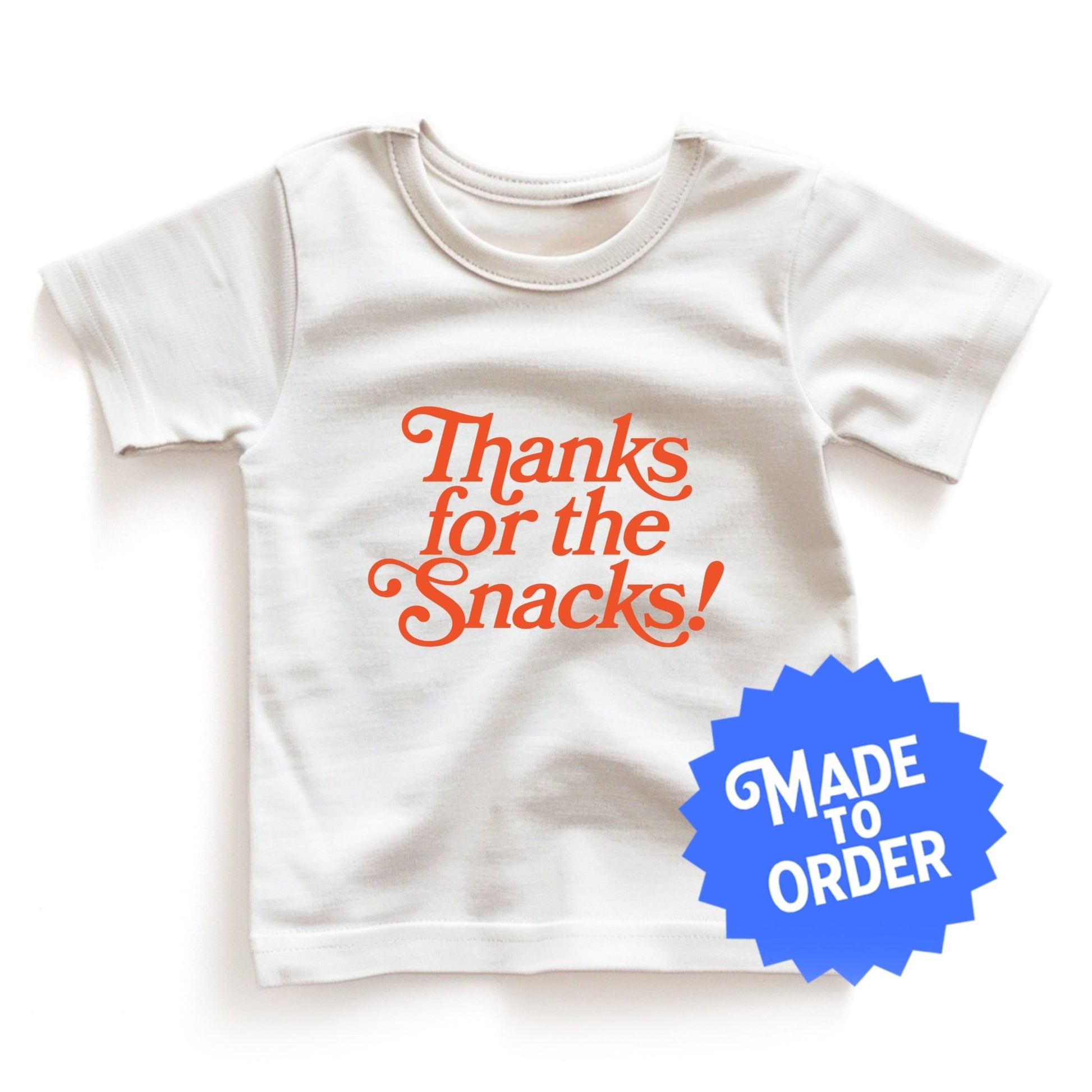 Chunky Deli product image: Natural-colored "Thanks for the Snacks!" kids and toddler t-short 100% cotton laid flat on a white background.