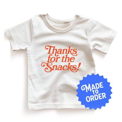 Chunky Deli product image: Natural-colored "Thanks for the Snacks!" kids and toddler t-short 100% cotton laid flat on a white background.