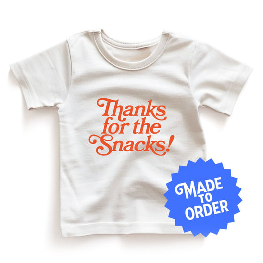 Chunky Deli product image: Natural-colored "Thanks for the Snacks!" kids and toddler t-short 100% cotton laid flat on a white background.