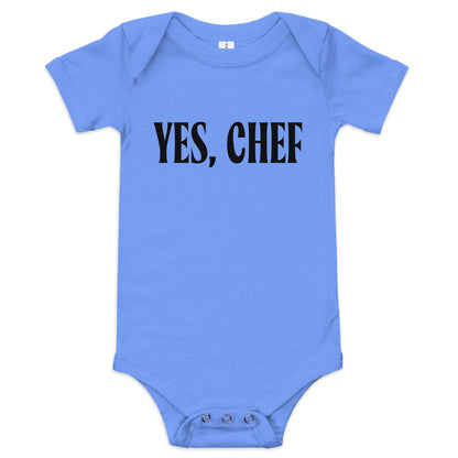  Chunky Deli product image: "Yes, Chef" onesie (100% cotton, blue color) laid flat on a white background, showcasing the envelope shoulders, short sleeves, three-snap closure, and the text "Yes, Chef" printed in black across the chest.