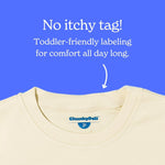 Chunky Deli beige shirt with a label on a blue background, featuring text about no itchy tag.