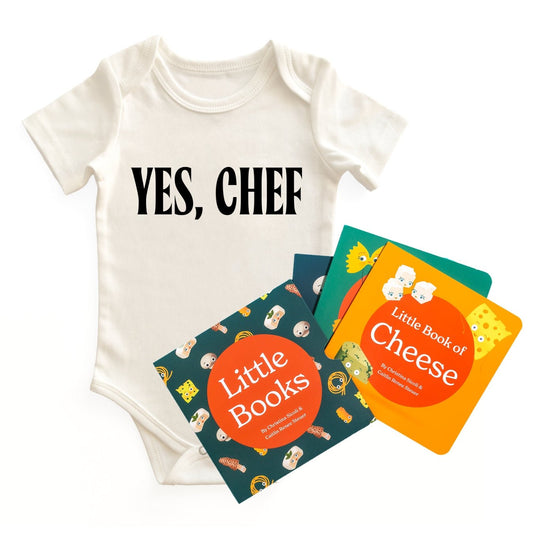  Chunky Deli "Yes, Chef Starter Pack" featuring a white, 100% cotton, short sleeve baby bodysuit with black "YES, CHEF" text, accompanied by the "Little Books: Tasty Collection" which includes "Little Book of Pasta," "Little Book of Cheese," and "Little B